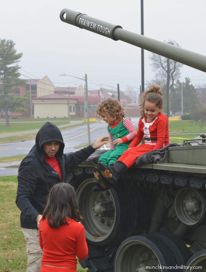 Army kids on a tank for Christmas photos