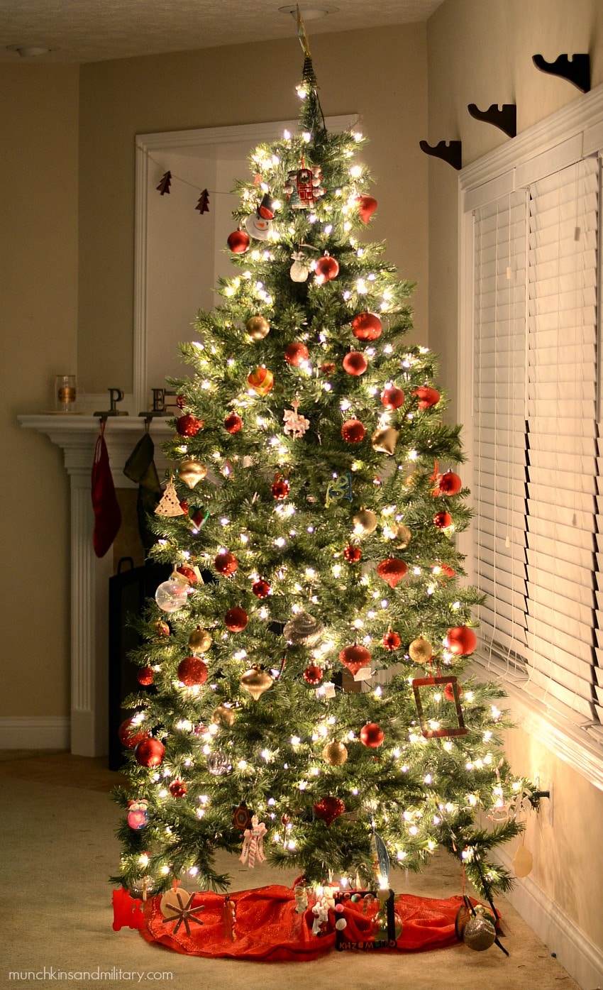 Glowing decorated Christmas tree with red ornaments