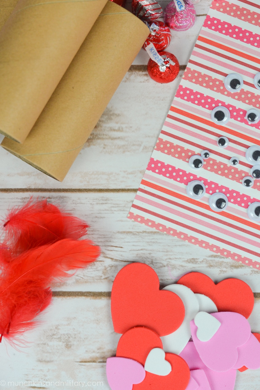Valentine's Day treat craft supplies! Cardboard rolls, googly eyes, feathers, and foam hearts