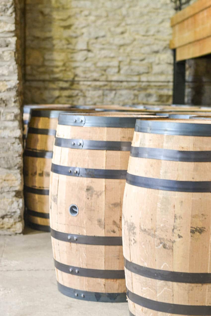 Woodford Reserve barrels in limestone building - Kentucky Bourbon Trail