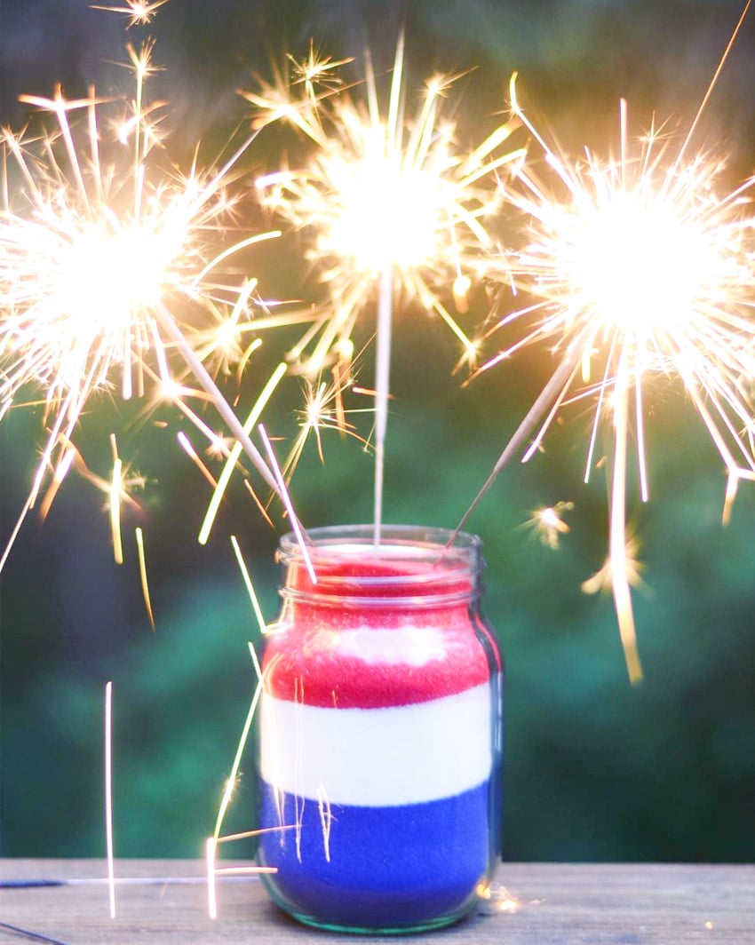 Easy 4th of July decor! Colored sand in a jar with sparklers!