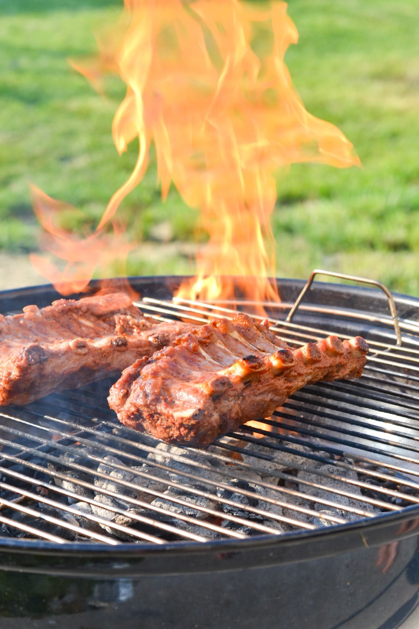 Cooking ribs on a flaming grill - Guava BBQ sauce recipe