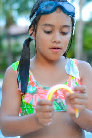 Say goodbye to summer with a fun glowing pool party!