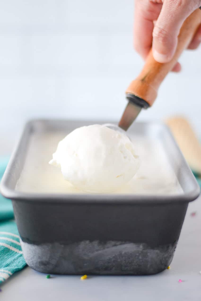 Scooping out homemade vanilla ice cream