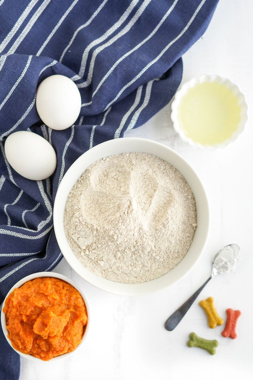 Ingredients for Pumpkin Pupcakes - eggs, flour, oil, and pumpkin puree