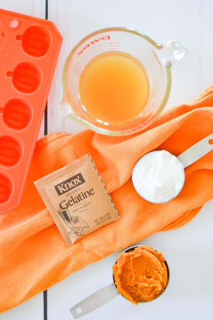 Measured out dog treat ingredients on orange hand towel