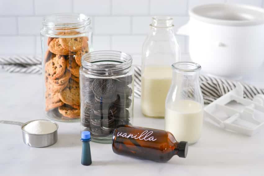 Ingredients for Cookie Monster Ice Cream on a white marble counter