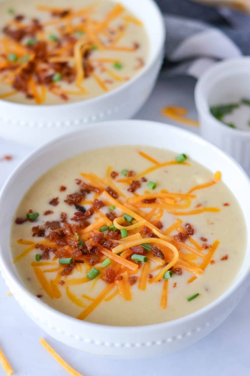 Garnished bowls of potato soup